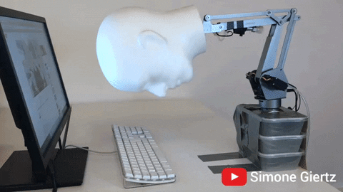 Robot on a computer keyboard
